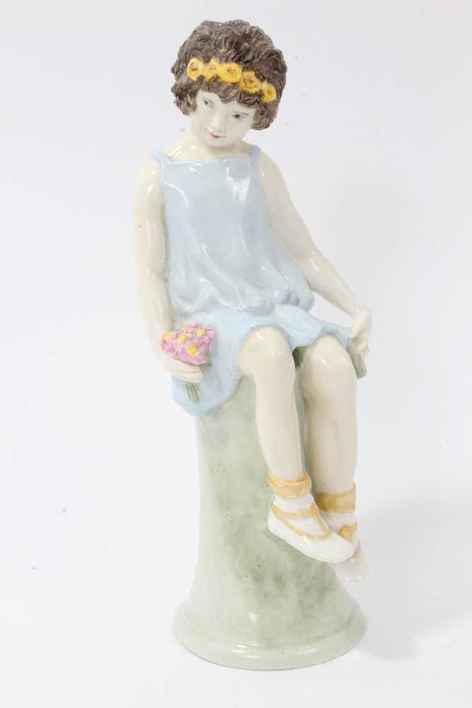 Lot 137 - Kathleen Goodwin for Wedgwood - porcelain figure of a seated girl with flowers