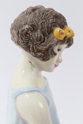 Lot 181 - Kathleen Goodwin for Wedgwood - porcelain figure of a seated girl with flowers