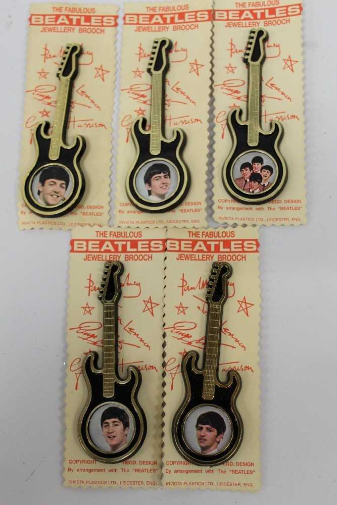 Lot 1965 - Group of original 'The Fabulous Beatles Brooch' in the form of a guitar, each depicting a different photograph of the group by Invicta Plastics Ltd