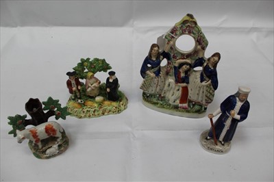 Lot 1009 - Group of four Staffordshire / Pearlware figures including a watch stand and Shylock (4)