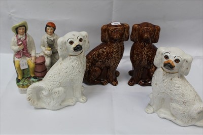 Lot 1010 - Two pairs of Staffordshire type Spaniels, together with a large Staffordshire figure of Tam O Shanter (5)