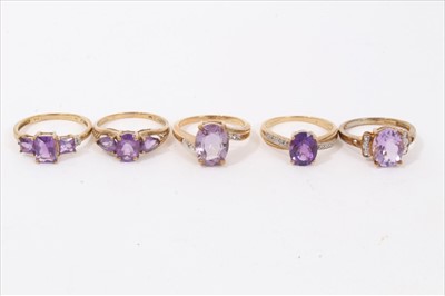 Lot 231 - Five 9ct gold amethyst and gem-set dress rings