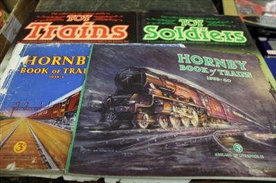 Lot 1437 - Hornby Book of Trains 1934-5, 1937-8, 1938-9 and 1939-40 plus two other toy books.