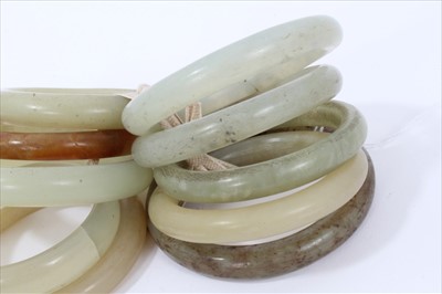 Lot 11 - Ten jade/green hard stone polished bangles