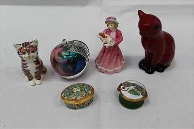 Lot 1012 - Royal Doulton Flambé Cat, together with a Royal Crown Derby Cat Paperweight, a Royal Doulton figure, an Art glass paperweight in the form of an Apple, and two enamel trinket boxes (6)
