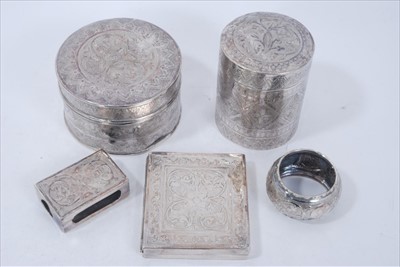 Lot 258 - Two Indian White metal boxes together with a similar cigarette case a match box cover and a napkin ring (5 pieces)