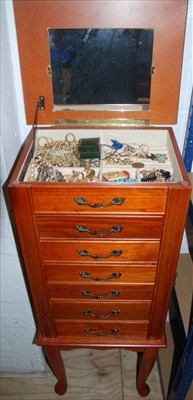 Lot 260 - Six draw jewellery cabinet with contents