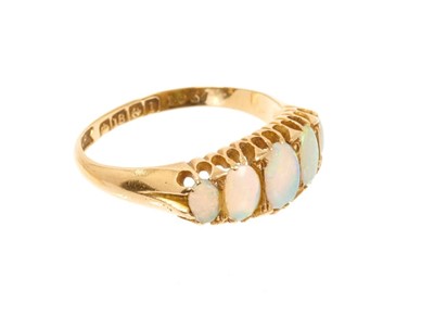 Lot 546 - Gold and opal dress ring