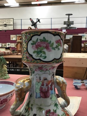 Lot 48 - 19th century Chinese Canton famille rose garlic form porcelain bottle vase, with elephant mask handles, finely painted with panels of figures