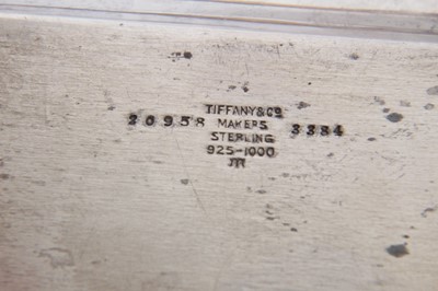 Lot 273 - Set of three Tiffany silver matchbox holders and three silver ashtrays in original  pochettes.