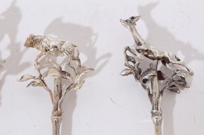 Lot 270 - Set of four silver pickle forks, together with a Dutch spoon, and a candle snuffer