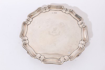 Lot 250 - Edwardian silver salver of circular form, with pie crust border.