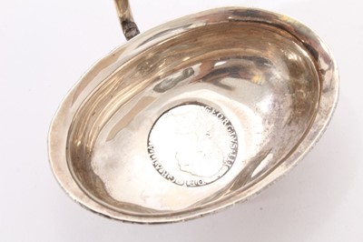 Lot 253 - Georgian silver toddy ladle of oval form and two other items.