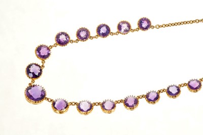 Lot 400 - Victorian amethyst necklace with graduated round mixed cut amethysts in gold collet setting