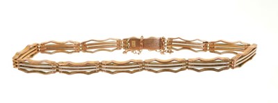 Lot 410 - Edwardian 9ct rose gold and white enamel gate bracelet