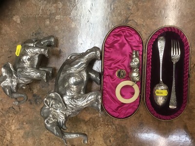 Lot 686 - Cased Victorian silver fork and spoon christening set and pair of white metal clad elephants