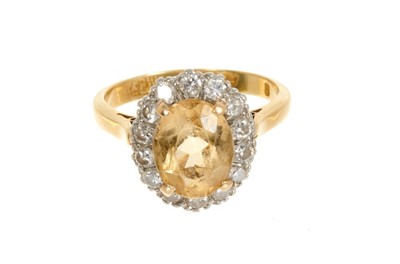 Lot 432 - Topaz and diamond cluster ring