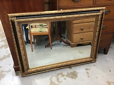 Lot 867 - Bevelled wall mirror in ornate gilt frame