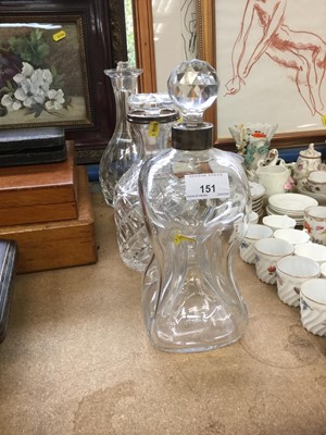 Lot 151 - Two silver mounted decanters, together with another (3)