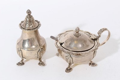 Lot 342 - 1920s silver mustard pot on hoof feet, with matching pepper.