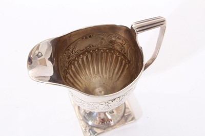 Lot 268 - Regency silver milk jug of helmet form