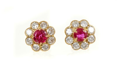 Lot 466 - Pair of ruby and diamond cluster earrings, each flower head cluster with a round mixed cut ruby surrounded by eight brilliant cut diamonds. Rubies estimated to weigh approximately 0.50ct in total....