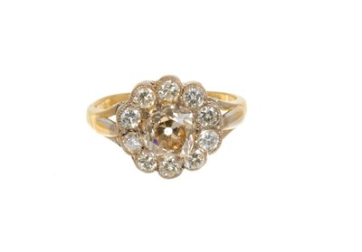 Lot 428 - Diamond flower head cluster ring with a central cushion-shape old cut diamond estimated approximately 1.51 carats surrounded by ten round brilliant cut diamonds in mille grain setting on 18ct gold...