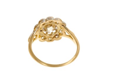Lot 428 - Diamond flower head cluster ring with a central cushion-shape old cut diamond estimated approximately 1.51 carats surrounded by ten round brilliant cut diamonds in mille grain setting on 18ct gold...
