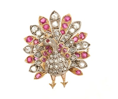 Lot 508 - Victorian style diamond and ruby novelty brooch in the form of a peacock with rose cut diamonds and mixed cut rubies to the plumage in silver and gold setting. 35mm