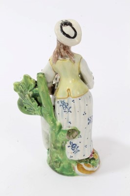 Lot 117 - A Bow putto with basket, circa 1765, and a pearlware figure of a shepherdess