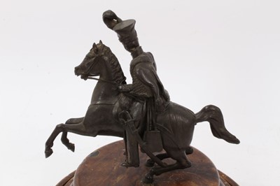 Lot 32 - A 19th century bronze figure of a Hussar on horseback, on turned wooden base