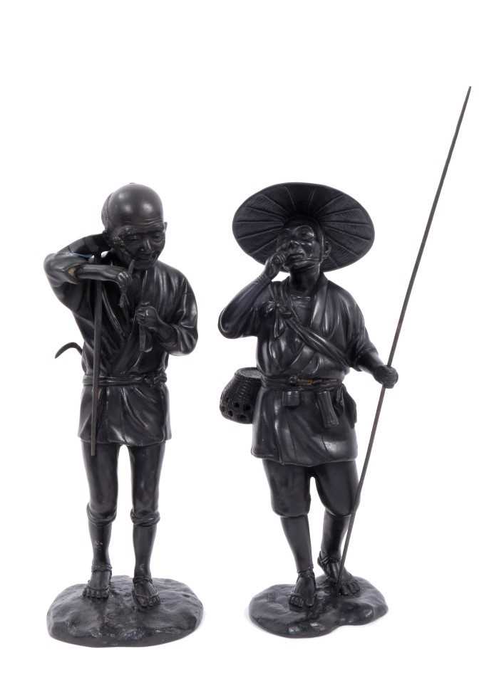 Lot 718 - Pair of Japanese Meiji period bronzes of a wood cutter and a farmer