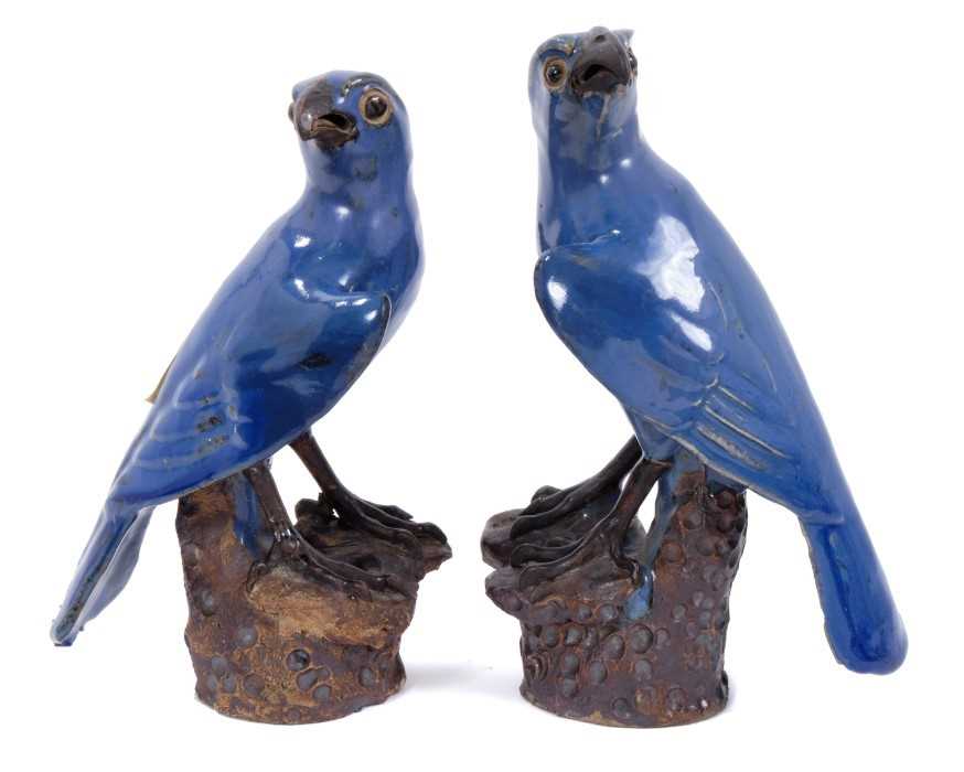 Lot 104 - Pair of Chinese Pottery Parrots with blue glazed decoration