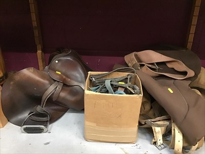 Lot 508 - Old leather saddle and accessories