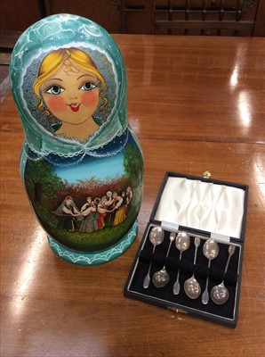 Lot 666 - Six silver coffee spoons in case and Russian wooden doll set