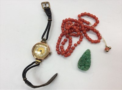 Lot 671 - Vintage 9ct gold wristwatch, antique coral necklace and carved green hardstone pendant