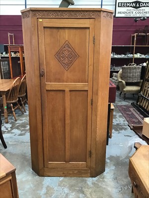 Lot 950 - Good quality hand carved and panelled light oak corner wardrobe/ hall cupboard