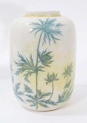 Lot 880 - Ruskin pottery canister decorated with blue foliage