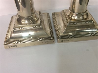 Lot 657 - Pair of silver dwarf candlesticks