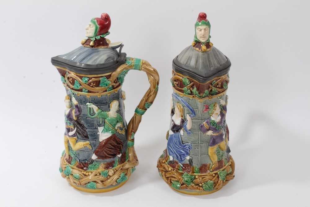 Lot 173 - A matched pair of Minton Majolica 'Tower' jugs, 1881 and 1883, 33cm height