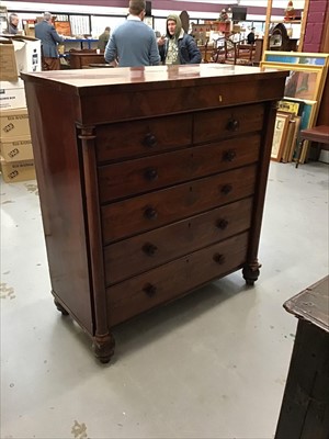 Lot 880 - Victorian mahogany chest of two short and four long drawers flanked by columns on bun feet.