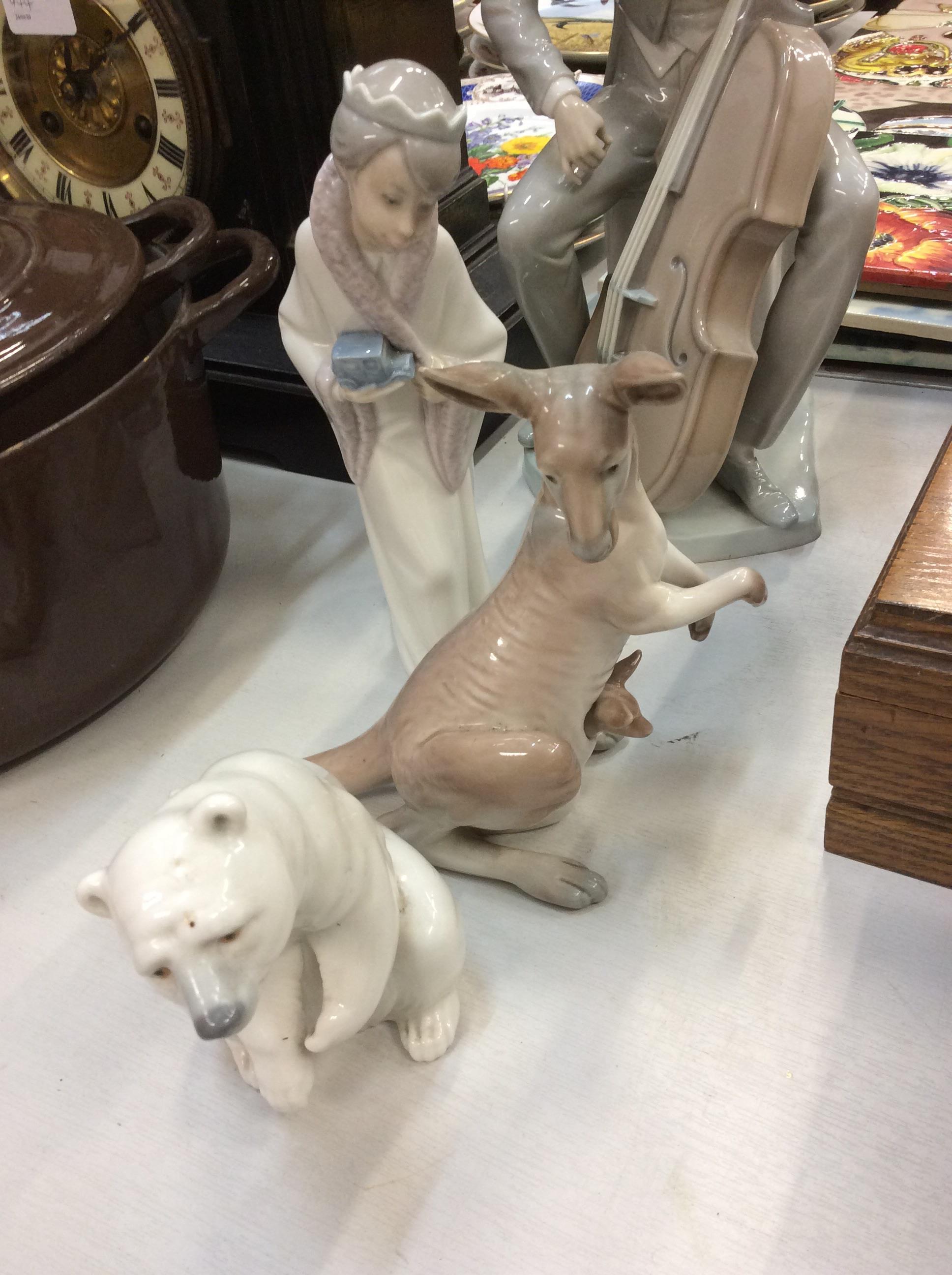 Lot 449 Four Lladro and two Nao ornaments