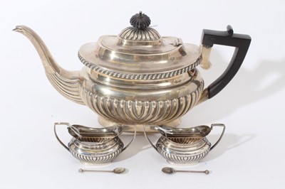 Lot 335 - Edwardian silver teapot and two salts with spoons.