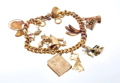 Lot 515 - Gold charm bracelet