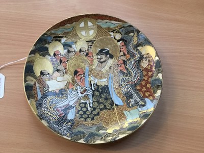 Lot 480 - Late 19th century Japanese Satsuma pottery charger decorated with dragon amongst figures