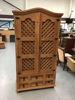 Lot 894 - Modern pine kitchen cupboard with fitted interior with wine rack enclosed by lattice doors