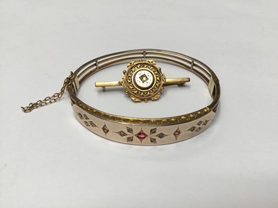Lot 170 - Victorian yellow metal bangle set with rubies and rose cut diamonds, together with Victorian bar brooch set with an old cut diamond