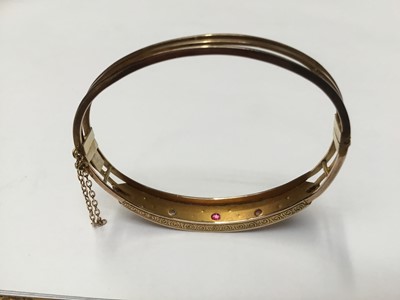 Lot 170 - Victorian yellow metal bangle set with rubies and rose cut diamonds, together with Victorian bar brooch set with an old cut diamond