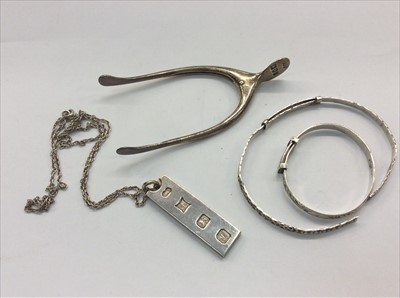 Lot 659 - Pair silver wishbone sugar tongs, silver ingot pendant and two bangles