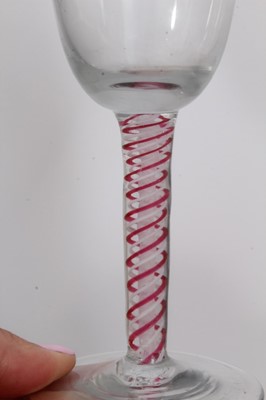 Lot 163 - 18th century Dutch wine glass with funnel bowl, on white gauze and red and white twist stem on plain foot, circa 1770, 14cm